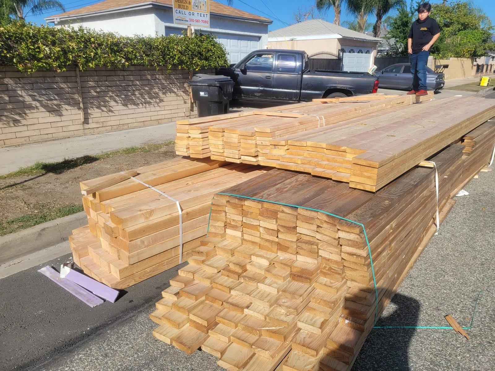 Large organized lumber delivery staged for a residential construction project